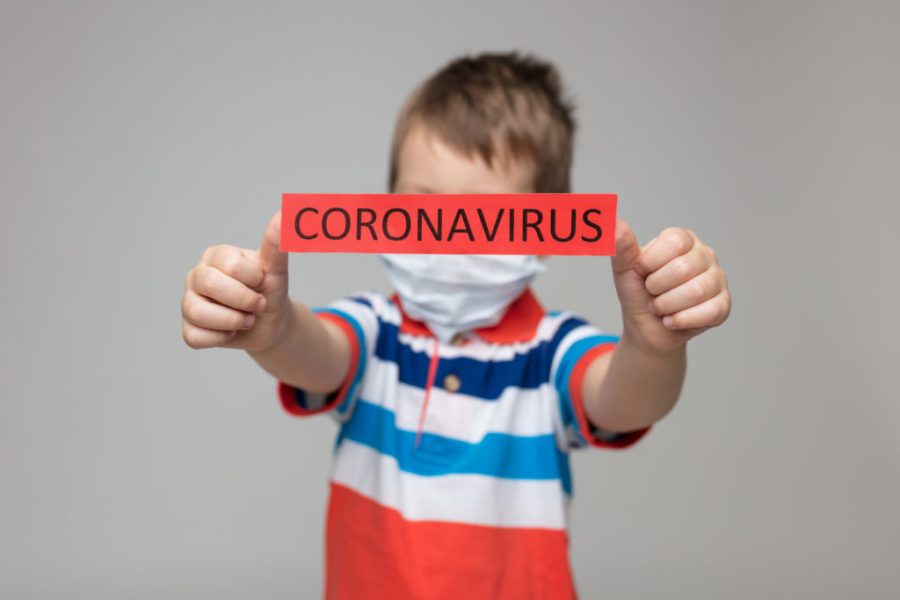 Young child wearing a respiratory mask as a prevention against the deadly Coronavirus Covid-19
