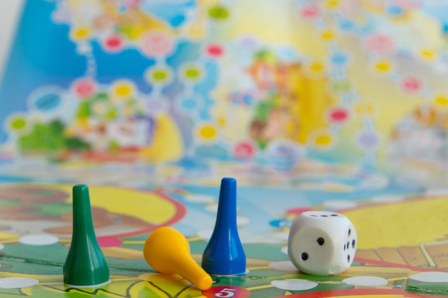 Blue, yellow and green plastic chips, dice and Board games for children .
